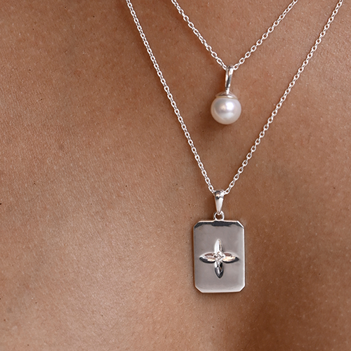 Two silver necklaces with pendants
